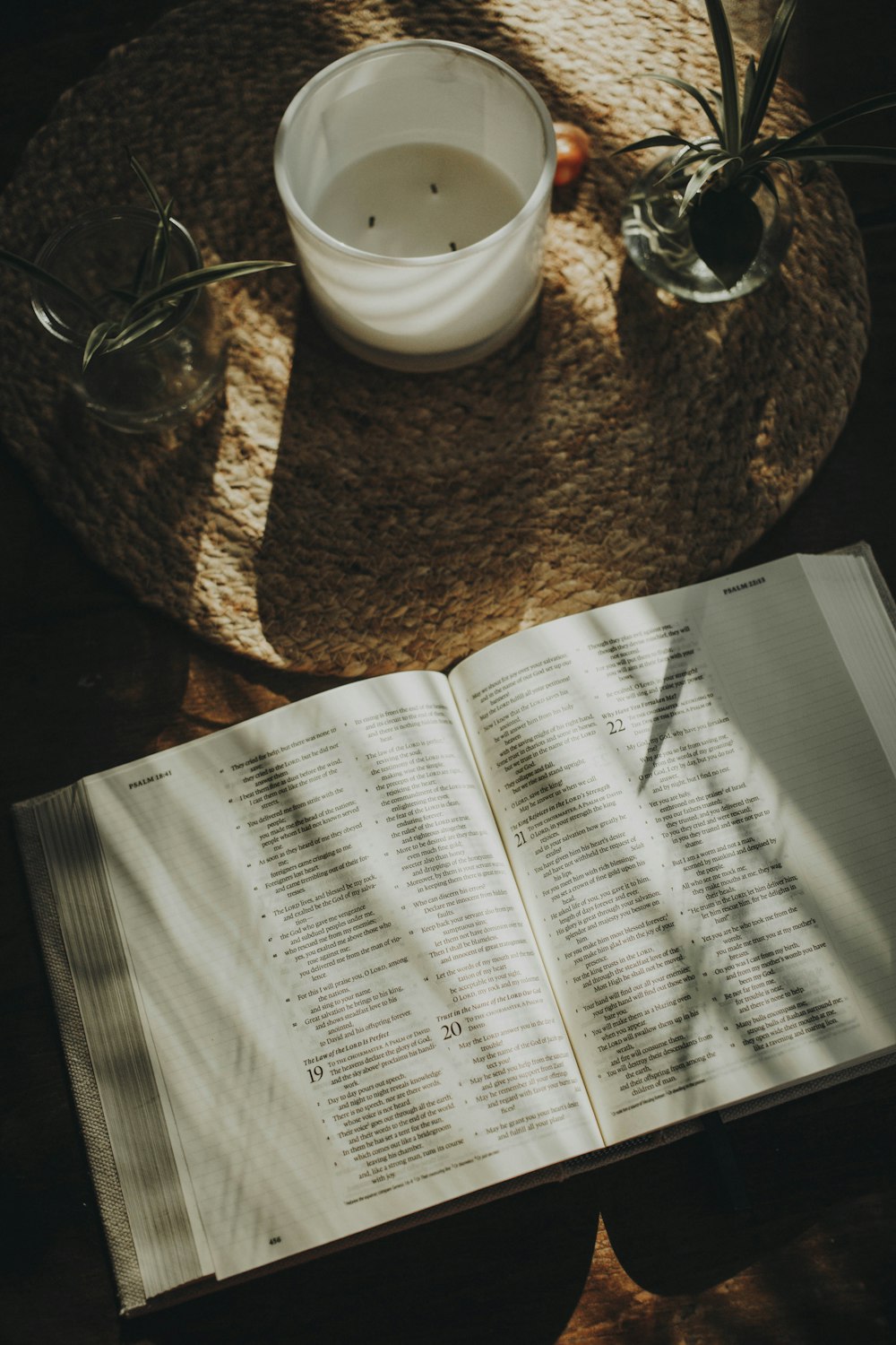 an open book sitting on top of a wooden table