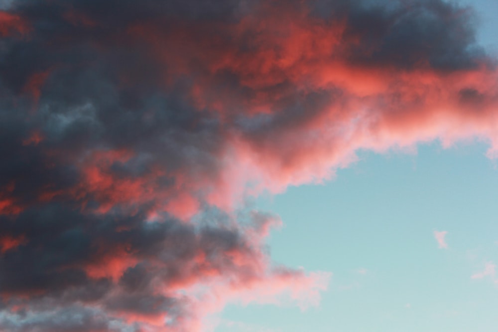 a plane flying in the sky with a lot of clouds