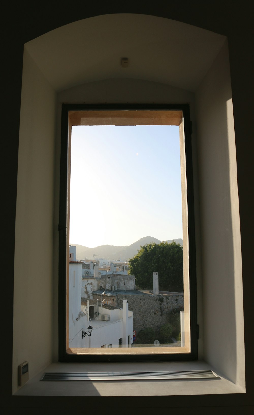 a window with a view of a city outside