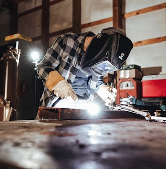 a welder working on a piece of metal