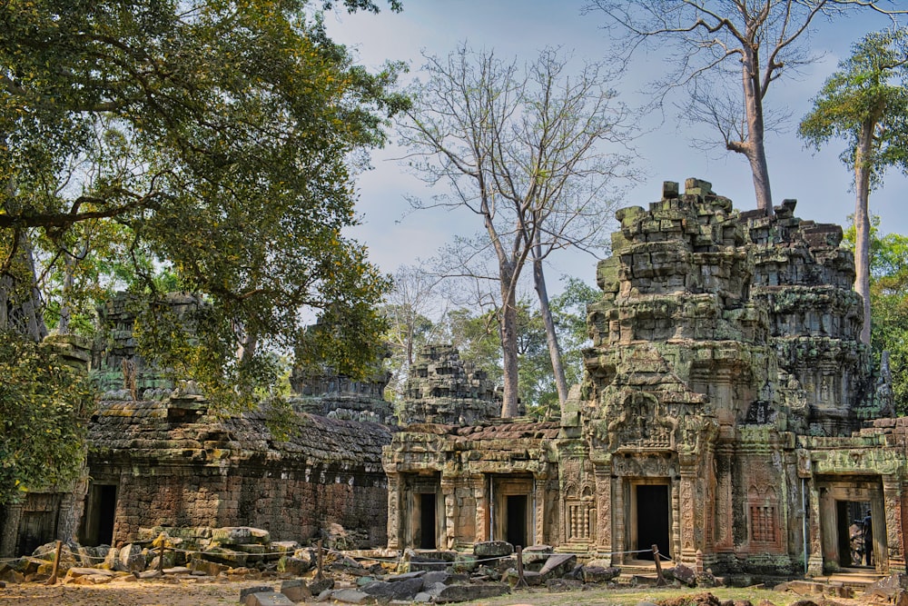 a group of stone buildings surrounded by trees