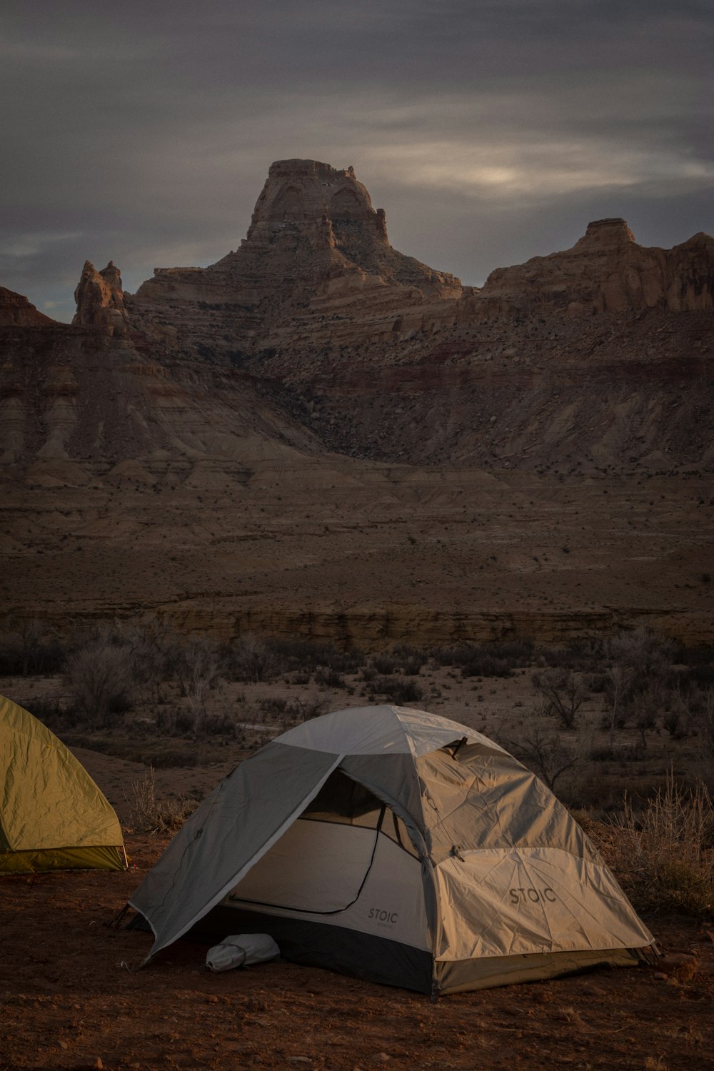 a couple of tents sitting in the middle of a desert