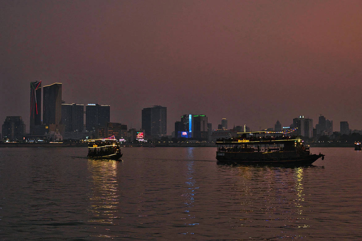 Boats navigating the Mekong River near Phnom Penh