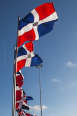 a group of flags blowing in the wind