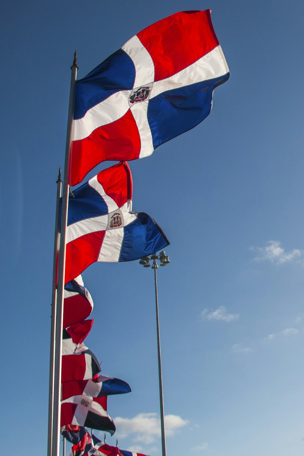 a group of flags blowing in the wind