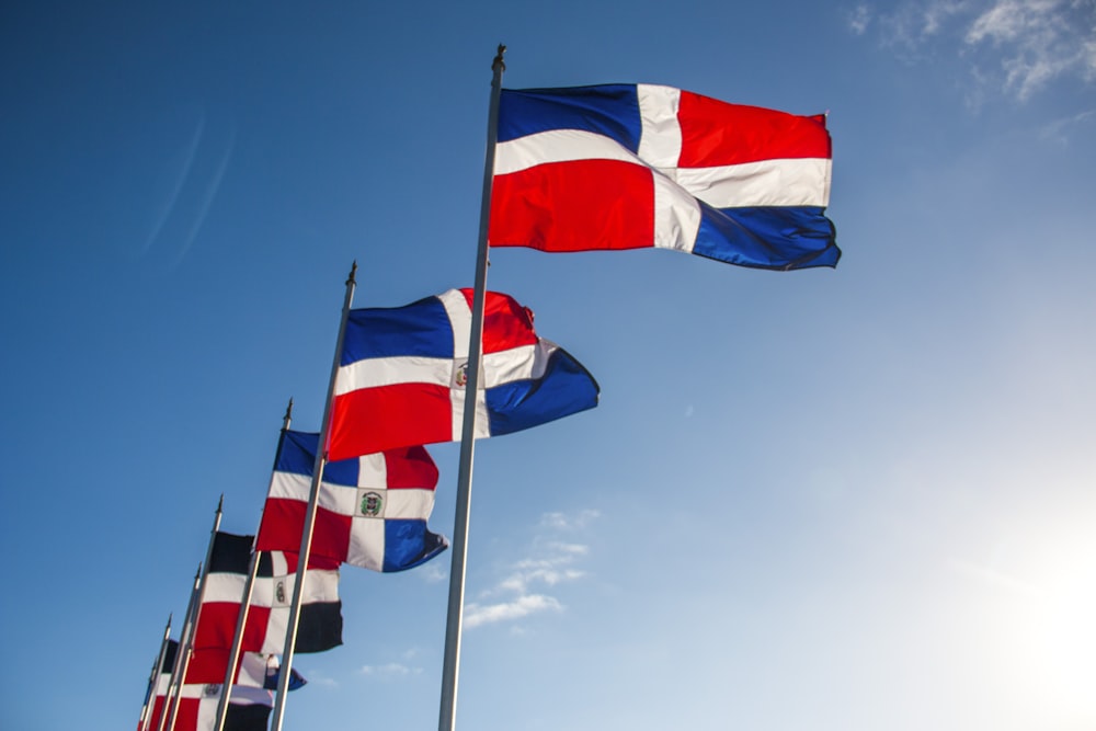 a group of flags flying in the air