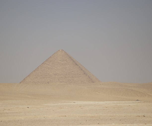 a very tall pyramid in the middle of a desert