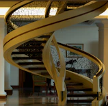 High-resolution image of a sleek metal spiral staircase in a modern home setting.