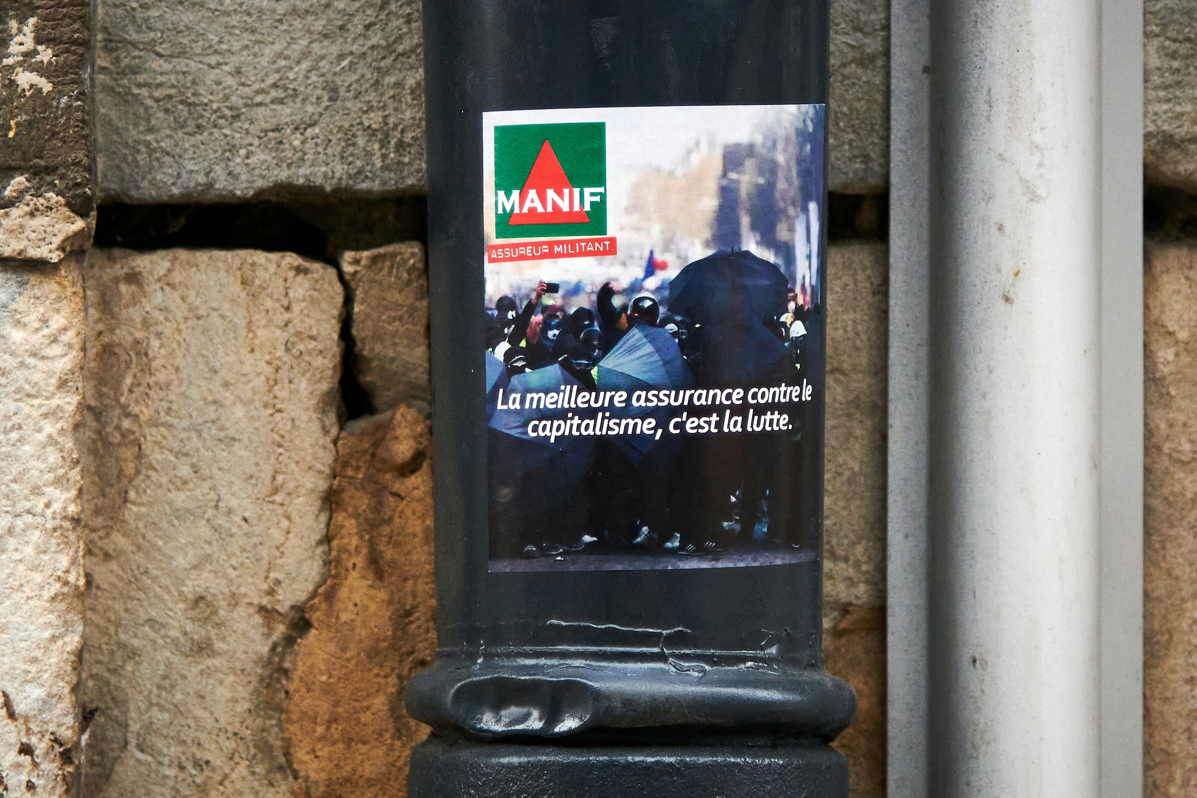 a black pole with a picture of a group of people on it