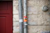 Close-up of a certified passive fire protection seal being carefully installed on a building wall.