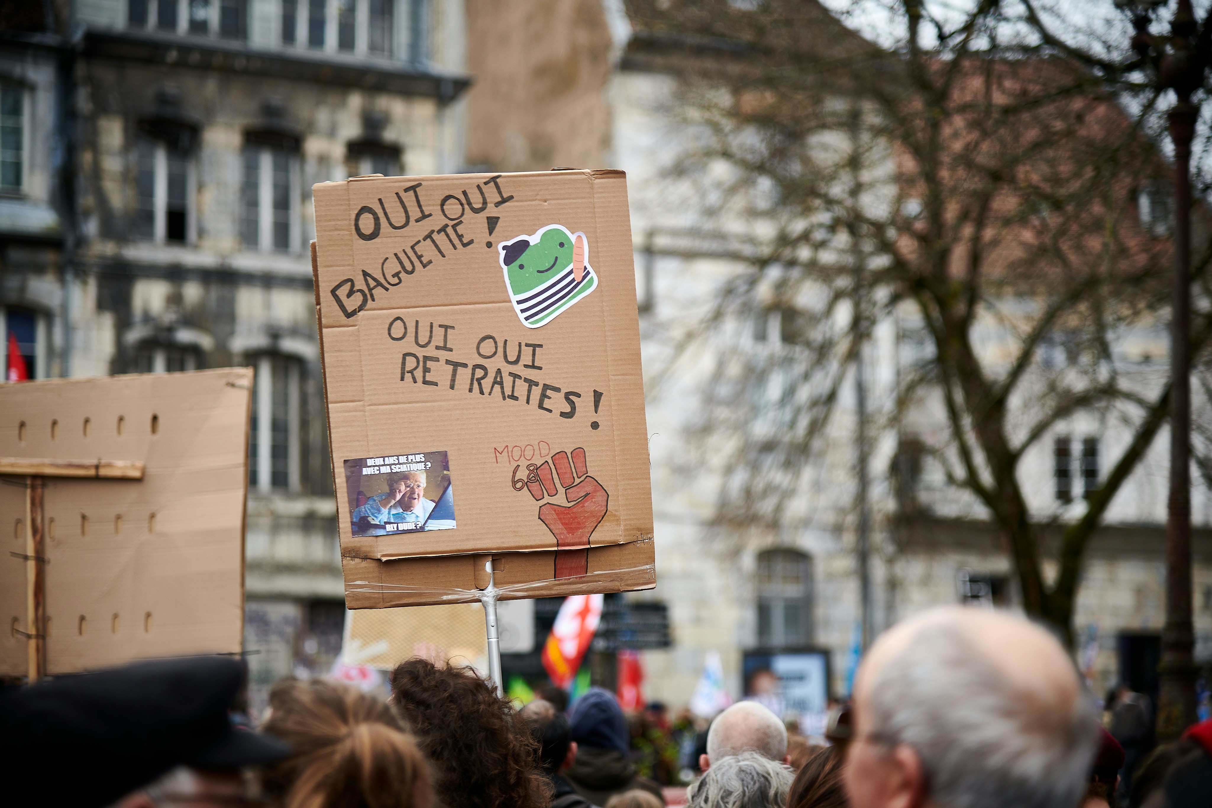 a group of people holding up signs and placards