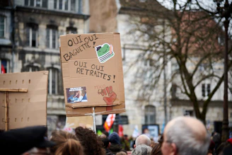 a group of people holding up signs and placards