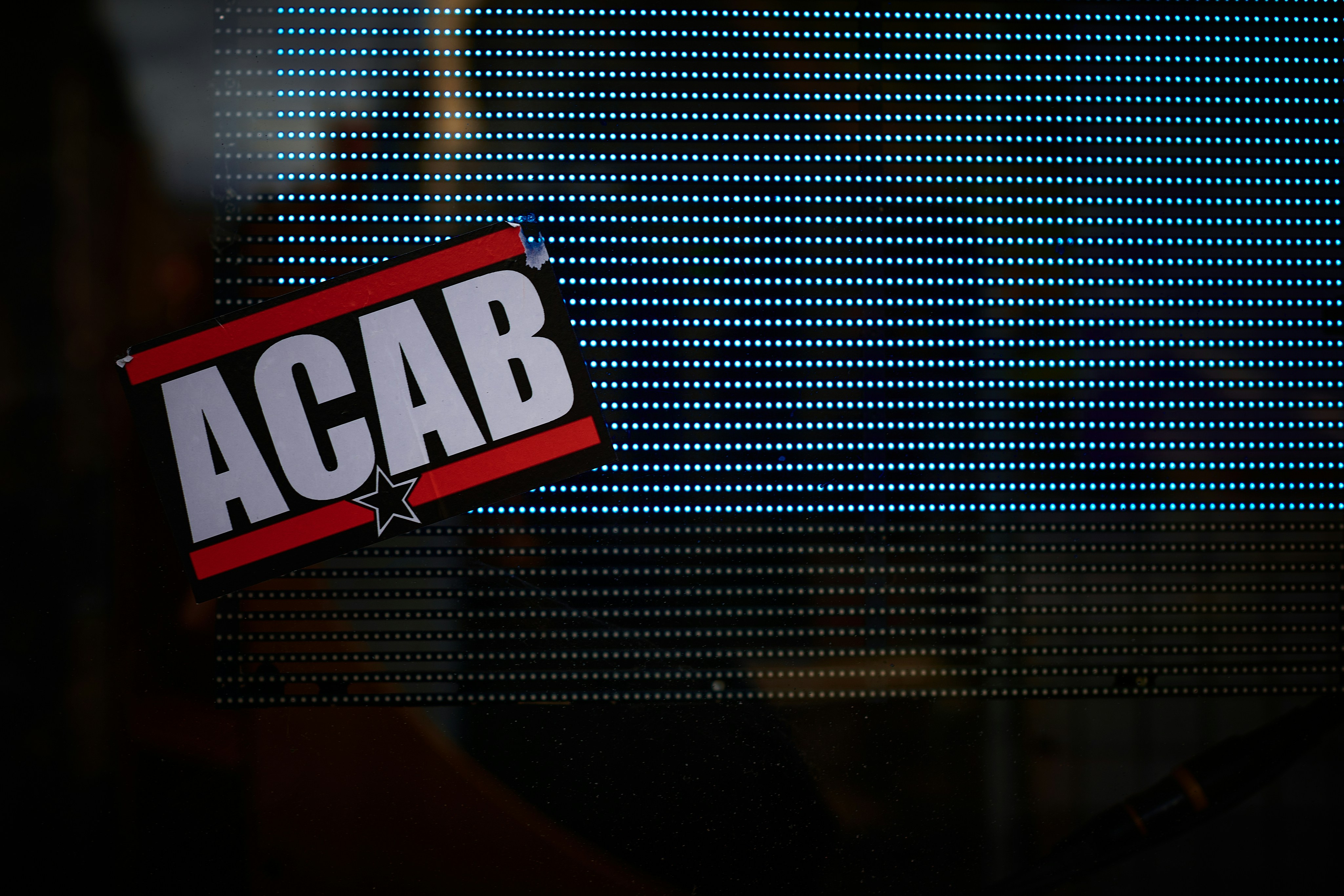 a sticker that reads acab on it