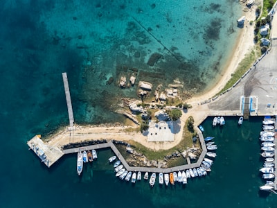 an aerial view of a marina with boats
