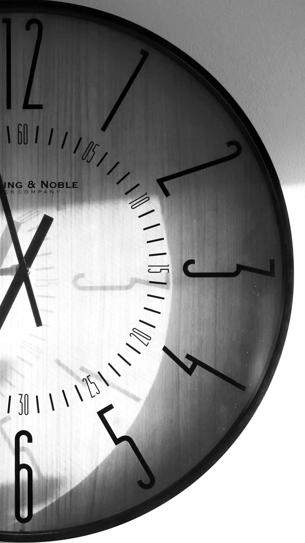 a black and white photo of a clock