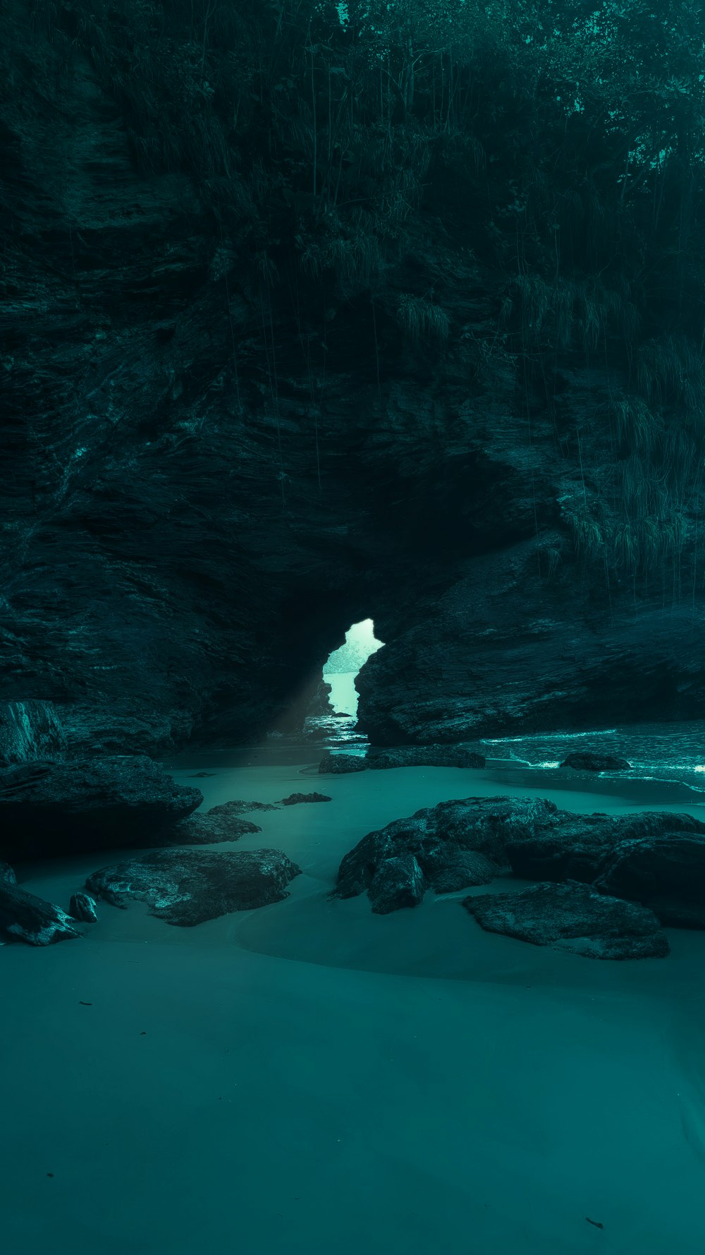 a cave with a body of water inside of it