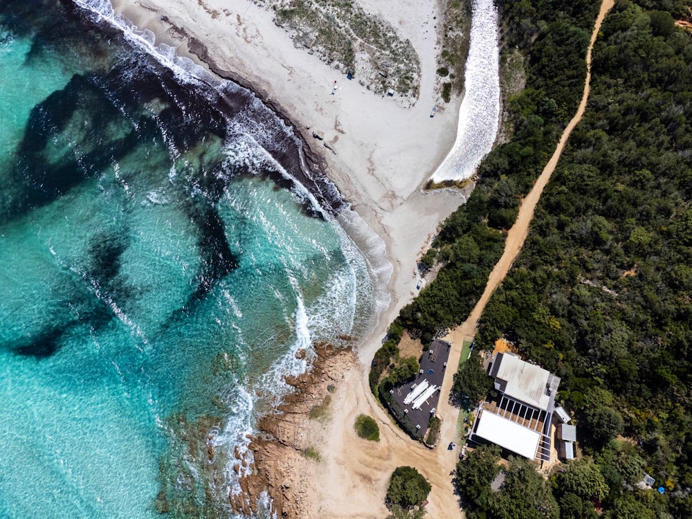 an aerial view of a house on the beach