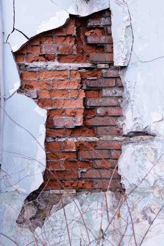 a brick wall with a hole in it