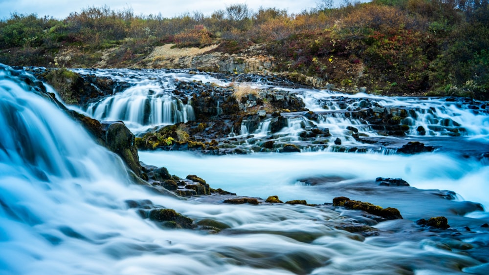 a large waterfall with lots of water running down it