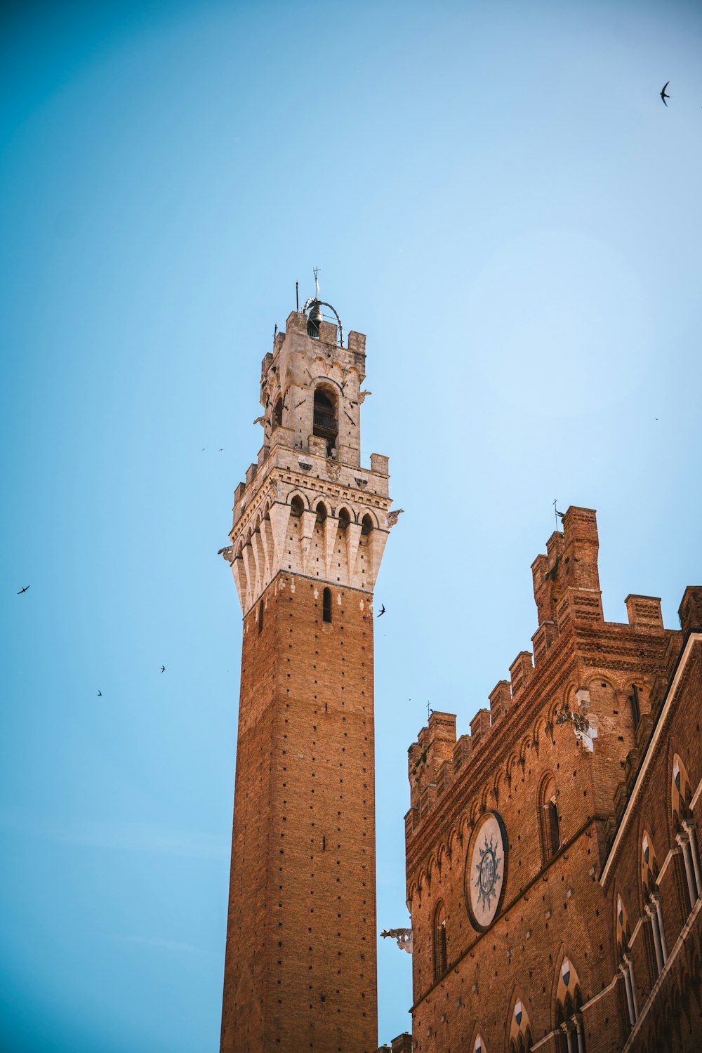 a tall clock tower towering over a city