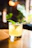 Close-up of a refreshing mojito with mint leaves and lime on a black elegant terrace table.