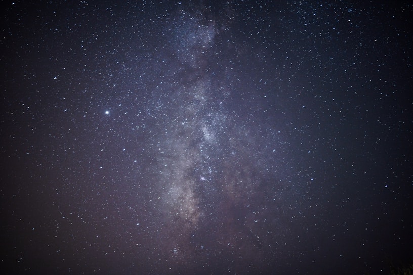 A glowing holographic viewscreen displaying a swirling galaxy with stars twinkling around it.