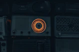 Close-up of retro radio dials and buttons glowing softly in a cozy room.