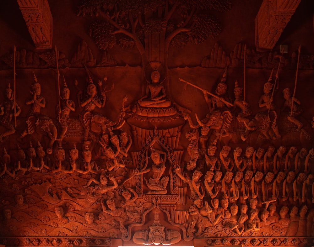a wall with a lot of carvings on it