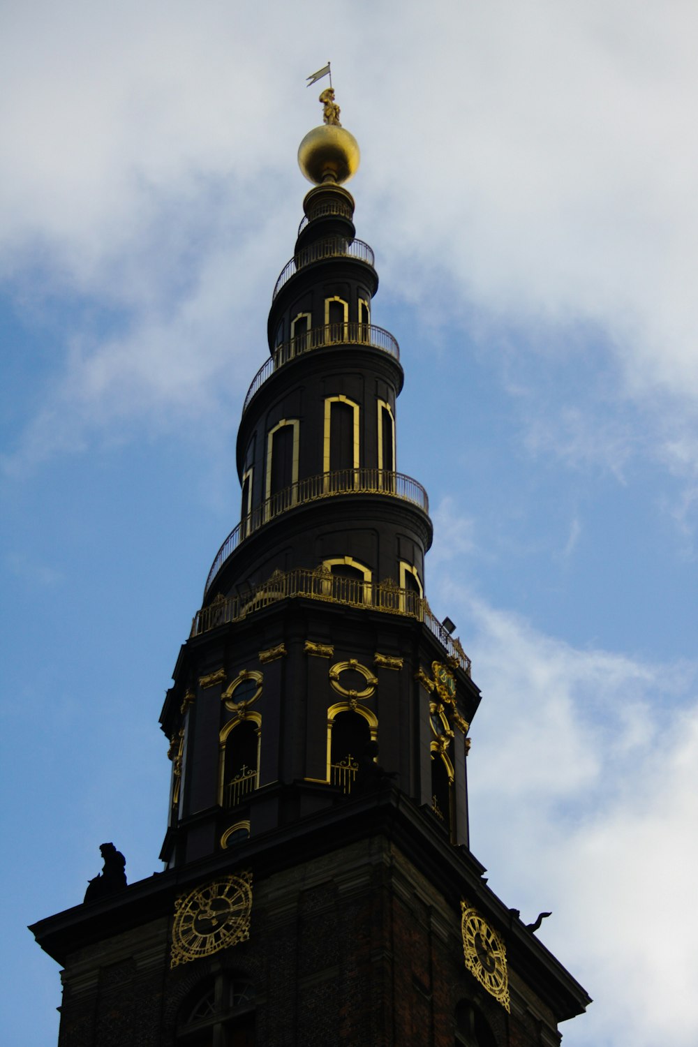 a tall clock tower with a sky background