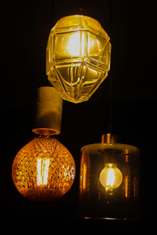 a couple of lights hanging from a ceiling