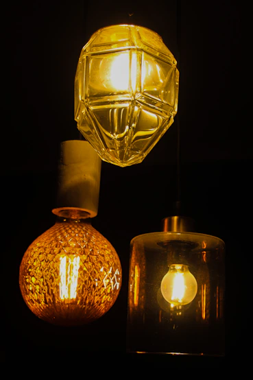 a couple of lights hanging from a ceiling