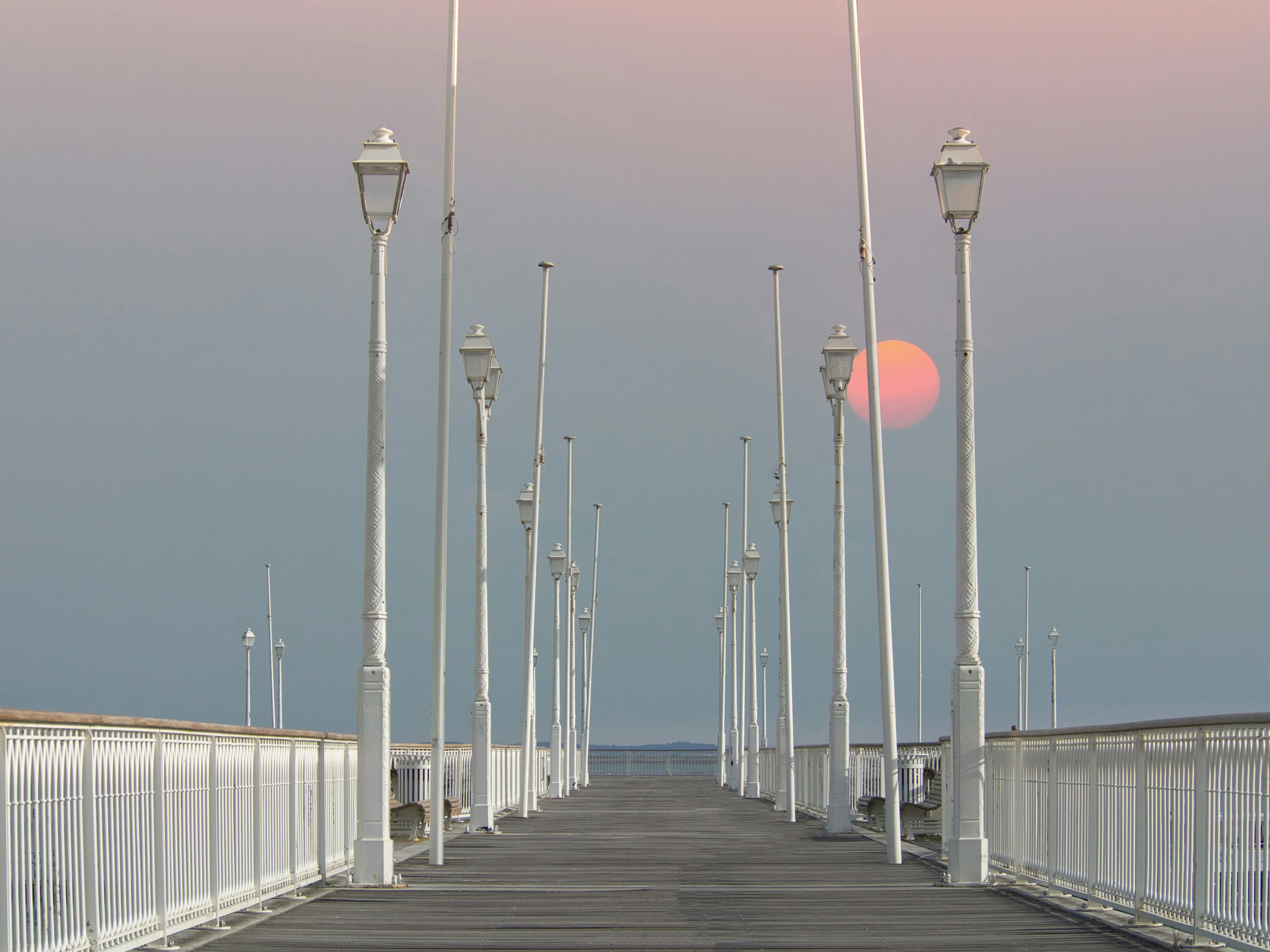a long bridge with street lights and street lamps