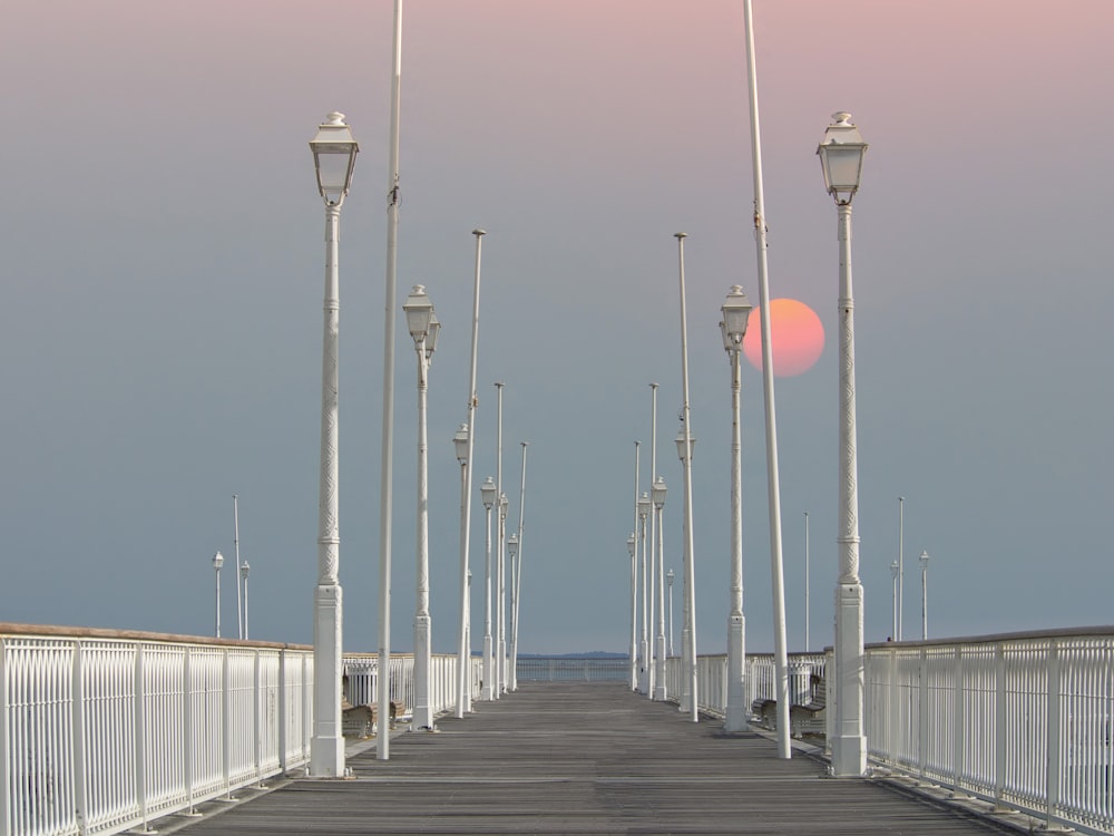 a long bridge with street lights and street lamps