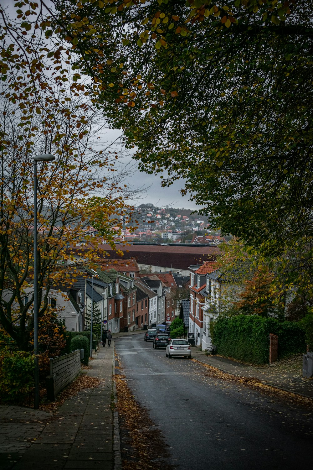 a city street with a few cars parked on the side of it