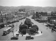 A restored frame from a silent film showing a bustling city square from the 1910s.