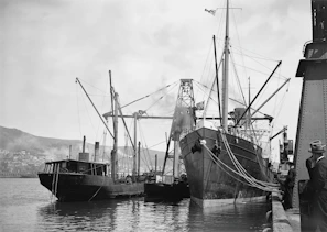 A vintage black-and-white photo of a bustling Southern Maryland waterfront in the early 1900s