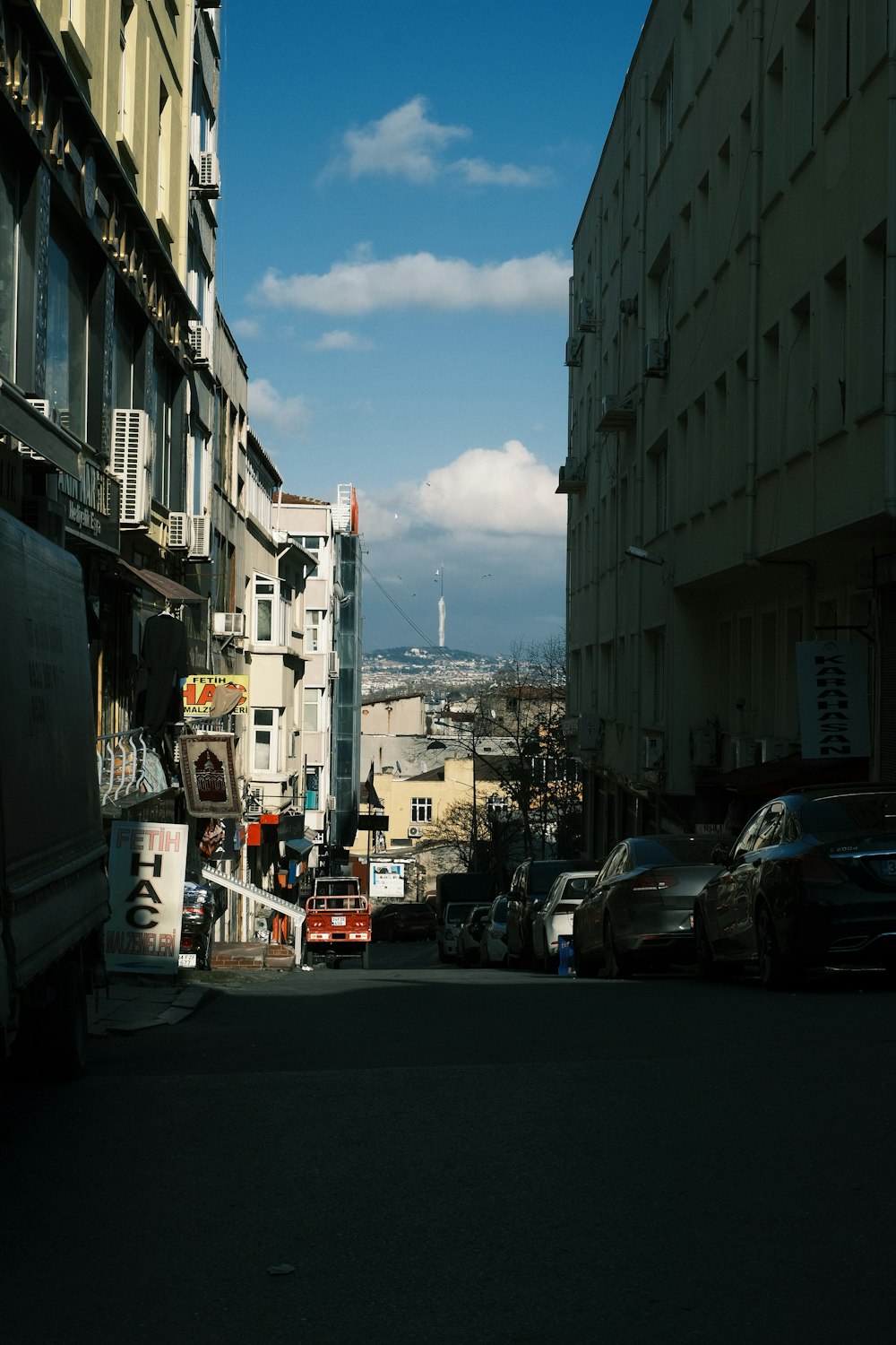 a city street filled with lots of tall buildings