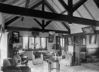 Sunlit living room with exposed beams and vintage decor.