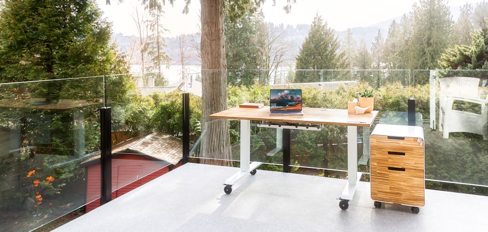 a desk with a laptop sitting on top of it