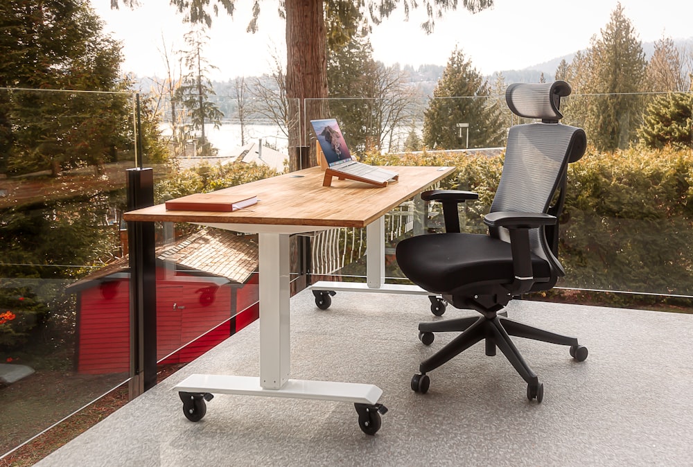 a desk with a laptop on top of it