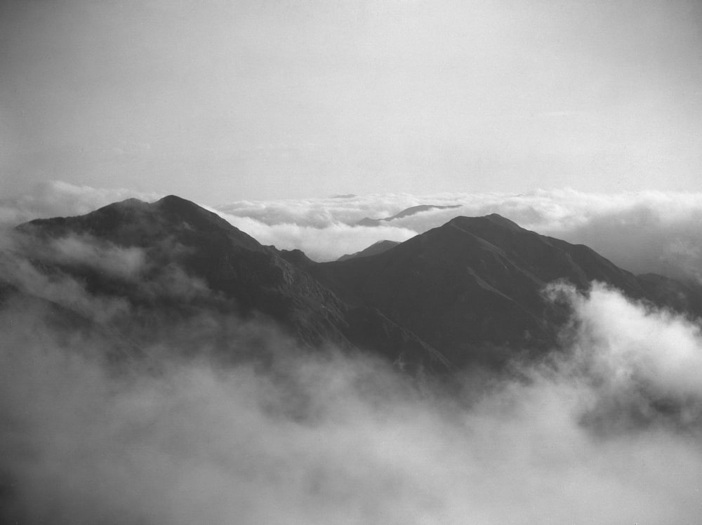 a black and white photo of some mountains