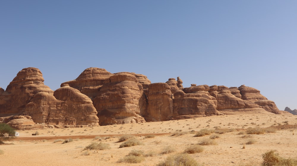 a group of large rocks in the desert