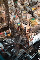 A sprawling commercial hub with bustling streets and kush holdings signage.