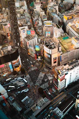 A bustling commercial complex with shops and offices, vibrant with activity.