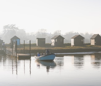 a small boat floating on top of a body of water