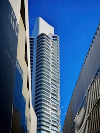 a very tall building next to a very tall building