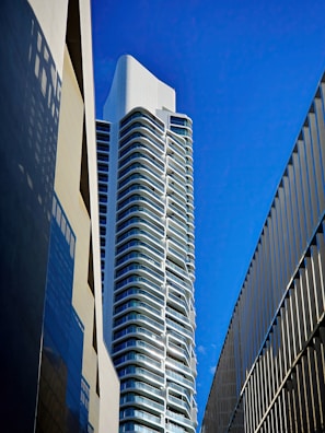 a very tall building next to a very tall building
