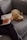 a woman sitting on a couch with a dog