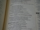 A close-up of an open book with a beautiful serif font.