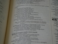 Detailed view of an open book showing a carefully balanced page layout and elegant fonts.